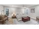 Cozy bedroom with neutral decor, wood-look floors, and a comfortable bed with decorative pillows at 207 Blythe Mill Rd, Waxhaw, NC 28173