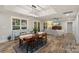 Bright dining area featuring wood table, hardwood flooring, and natural light at 207 Blythe Mill Rd, Waxhaw, NC 28173