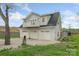 Three car garage with a second story and a balcony at 207 Blythe Mill Rd, Waxhaw, NC 28173
