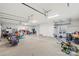 Spacious garage with multiple work areas, overhead lighting, and windows providing great light and functionality at 207 Blythe Mill Rd, Waxhaw, NC 28173