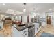 Bright kitchen featuring an island and stainless steel appliances at 207 Blythe Mill Rd, Waxhaw, NC 28173
