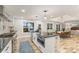 Modern kitchen featuring a large island, farmhouse sink and stainless steel appliances at 207 Blythe Mill Rd, Waxhaw, NC 28173