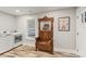 Modern laundry room features a front load washer/dryer, storage shelves, and an antique hall tree at 207 Blythe Mill Rd, Waxhaw, NC 28173