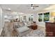 Open-concept living room with wood floors, a cozy couch, and lots of natural light at 207 Blythe Mill Rd, Waxhaw, NC 28173