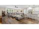 Inviting living room featuring an open layout with a comfortable gray sectional couch and kitchen area at 207 Blythe Mill Rd, Waxhaw, NC 28173