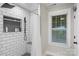 Modern shower with subway tile, black fixtures, and a built-in niche at 207 Blythe Mill Rd, Waxhaw, NC 28173