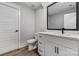 Clean bathroom featuring white cabinets, dark hardware, and luxury vinyl flooring at 2085 Fordhill St, Rock Hill, SC 29362