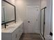 Modern bathroom with double vanity sinks and a glass-enclosed shower at 2085 Fordhill St, Rock Hill, SC 29362