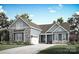 Beautiful exterior elevation featuring stone accents, blue siding, and a well-manicured lawn at 2085 Fordhill St, Rock Hill, SC 29362