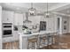 Bright kitchen features a large island with seating, stainless steel appliances, and modern pendant lighting at 2085 Fordhill St, Rock Hill, SC 29362