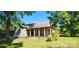 Quaint exterior view with a welcoming front porch and mature trees at 224 Charlotte St, York, SC 29745