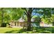 Charming exterior with mature tree, covered porch and partially updated construction is brimming with potential at 224 Charlotte St, York, SC 29745