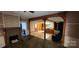 Open-concept living space with a fireplace and kitchen view at 224 Charlotte St, York, SC 29745