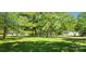 Expansive green property with mature trees and charming neighborhood homes at 224 Charlotte St, York, SC 29745