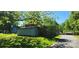 Quaint brick building sits just off the beaten path, surrounded by mature trees at 224 Charlotte St, York, SC 29745