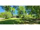 Expansive yard, mature trees and charming exterior of partially renovated home is brimming with potential at 224 Charlotte St, York, SC 29745