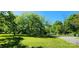 Expansive yard and mature trees surround a partially renovated home ready for the new owners to complete construction at 224 Charlotte St, York, SC 29745