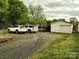 The backyard offers a driveway and parking space with a detached garage at 2508 S Main St # 68, Concord, NC 28027