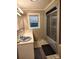 Cozy bathroom featuring a tub with sliding doors and a vanity with a blue sink at 2508 S Main St # 68, Concord, NC 28027