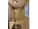 Charming bathroom with patterned wallpaper, a glass-enclosed shower, and a vanity at 2508 S Main St # 68, Concord, NC 28027