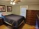 Bedroom featuring a queen-sized bed and a large wooden dresser next to a window at 2508 S Main St # 68, Concord, NC 28027