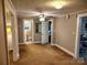 Neutral bedroom featuring a ceiling fan, carpeted floors and natural light from a large window at 2508 S Main St # 68, Concord, NC 28027