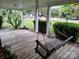 Inviting covered front porch with a relaxing swing, perfect for enjoying the outdoors at 2508 S Main St # 68, Concord, NC 28027