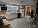 Bright kitchen with butcher block counters, white appliances, and a dining area for casual meals at 2508 S Main St # 68, Concord, NC 28027