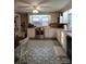 Well-lit kitchen features stainless steel appliances, white cabinets, and a view of the backyard at 2508 S Main St # 68, Concord, NC 28027