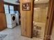 Laundry room featuring washer and dryer leading into bathroom area at 2508 S Main St # 68, Concord, NC 28027