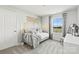 Charming bedroom featuring neutral decor, a cozy daybed, a statement wall hanging, and natural light at 290 Bezelle Ave, York, SC 29745