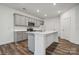 Modern kitchen featuring stainless steel appliances, an island, and wood-look flooring at 290 Bezelle Ave, York, SC 29745