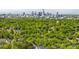 An aerial view of the city skyline surrounded by lush green trees showcasing the city landscape at 3228 E Ford Rd, Charlotte, NC 28205