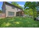 Spacious backyard with a covered patio and well-manicured lawn at 3228 E Ford Rd, Charlotte, NC 28205