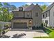 Charming two-story home with a two-car garage, a well-manicured lawn, and tasteful landscaping around the front entrance at 3228 E Ford Rd, Charlotte, NC 28205