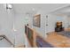 Second floor hallway featuring hardwood floors and access to the living room and bedrooms at 3228 E Ford Rd, Charlotte, NC 28205