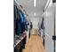 Organized walk-in closet with ample shelving, hardwood floors and storage space, maximizing functionality at 3228 E Ford Rd, Charlotte, NC 28205