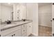 Bathroom featuring double sink vanity with granite counters and a view of the closet at 3330 Strong Box Ln, Gastonia, NC 28052