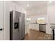 Spacious kitchen featuring stainless steel refrigerator and a view of the backyard at 3330 Strong Box Ln, Gastonia, NC 28052