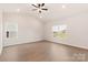 Bright main bedroom featuring hardwood floors and views of the backyard at 3330 Strong Box Ln, Gastonia, NC 28052