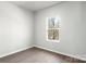 Minimalist bedroom with vinyl floors, a window, and neutral walls at 3435 Saddlebred Dr, Gastonia, NC 28052