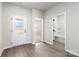Clean hallway showcasing access to a bathroom, bedroom and exterior door at 3435 Saddlebred Dr, Gastonia, NC 28052