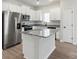 Modern kitchen with white cabinets, stainless steel appliances, and a stylish granite island at 3435 Saddlebred Dr, Gastonia, NC 28052
