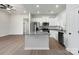 Well-lit kitchen featuring a granite island, stainless steel appliances, and ample cabinet space at 3435 Saddlebred Dr, Gastonia, NC 28052
