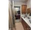 Bathroom showcasing sink vanity and view into bedroom and closet at 3603 Nc 90 E Hwy, Taylorsville, NC 28681