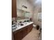 Bathroom with a single sink vanity, mirror, and toilet at 3603 Nc 90 E Hwy, Taylorsville, NC 28681