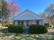 Charming one-story home with covered porch and quaint curb appeal surrounded by mature trees at 3603 Nc 90 E Hwy, Taylorsville, NC 28681