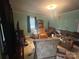 Cozy living room with comfortable seating, a television, and warm lighting at 3603 Nc 90 E Hwy, Taylorsville, NC 28681