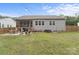 Grassy backyard with a patio, outdoor seating, and a hot tub, perfect for entertaining at 367 Neely Store Rd, Rock Hill, SC 29730