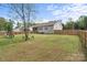Spacious fenced backyard with seating area, playset, and well-manicured lawn at 367 Neely Store Rd, Rock Hill, SC 29730